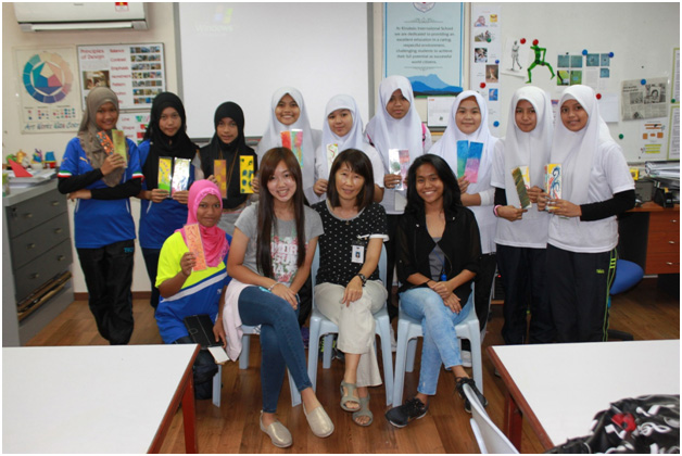 Group of students, teacher from KIS, and student assistant.